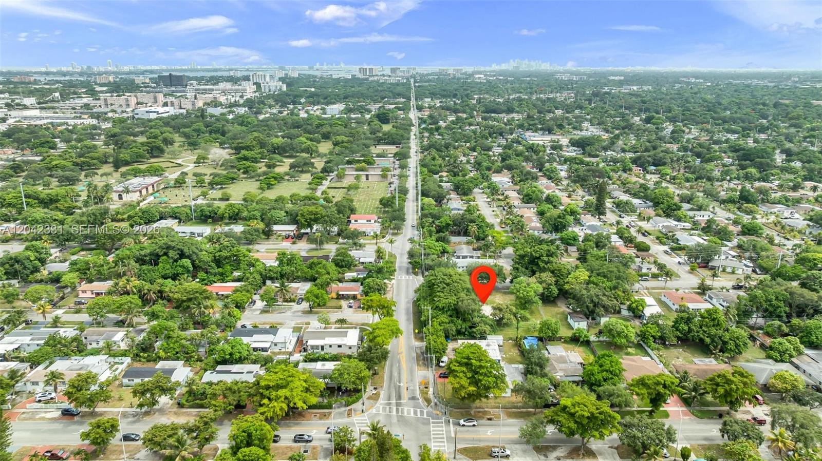An aerial view shows a residential neighborhood with a red pin marking a vacant lot — 1585 NE 158th St, North Miami Beach FL 33162, NORTH MIAMI BEACH, FL