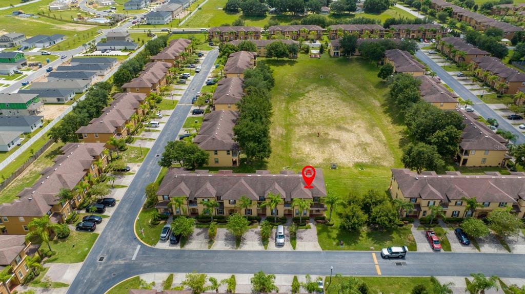An aerial view shows a multi-unit townhouse complex with a red location pin — 206 BERGAMO DRIVE, DAVENPORT, FL