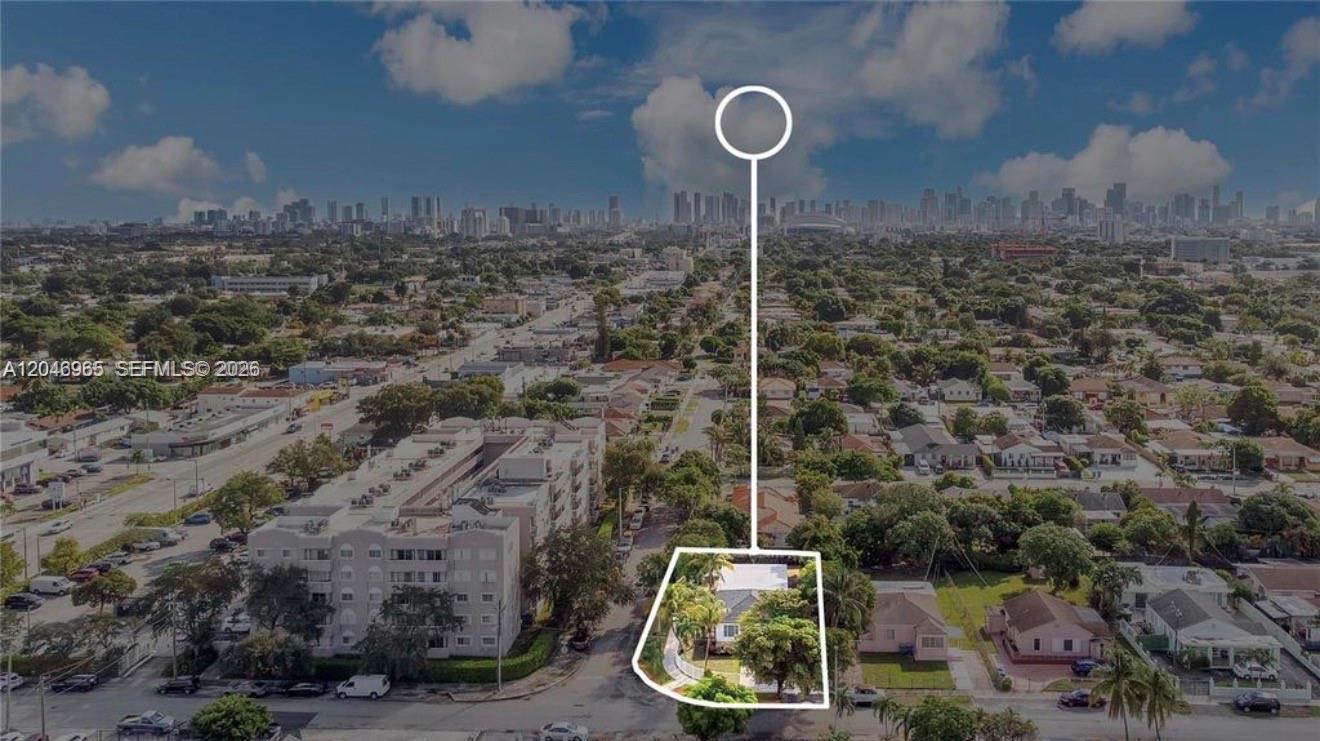 An aerial view shows a residential house outlined in white within a suburban neighborhood — 521 NW 33rd Ave # 1, Miami FL 33125, MIAMI, FL