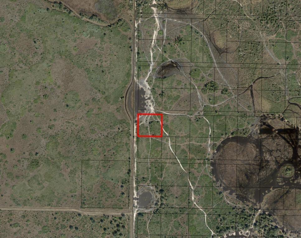 This is an aerial map showing a red-outlined parcel of land near a dirt road — 0 NW 308th Street, Okeechobee FL 34972, OKEECHOBEE, FL