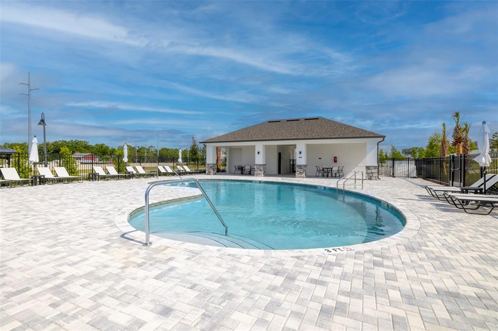 An outdoor swimming pool with a surrounding paver deck and a covered pavilion — 4707 LAUREL SITE LOOP, APOPKA, FL