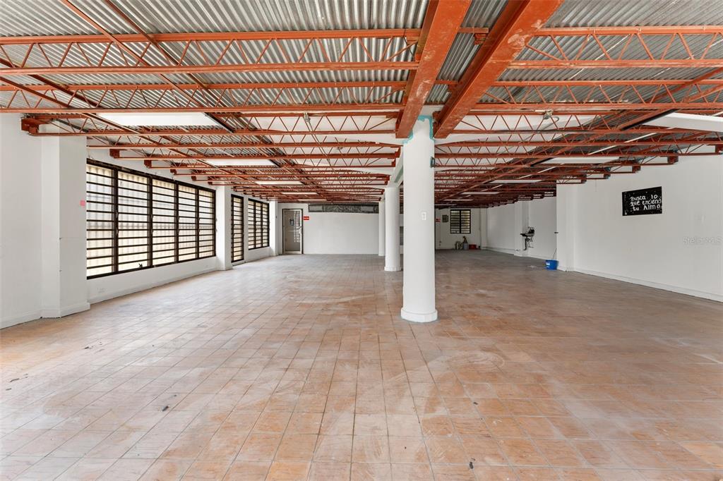 An open commercial space features a tiled floor, exposed metal ceiling, and white support columns — 241 ELEANOR ROOSEVELT AVENUE, SAN JUAN, PR