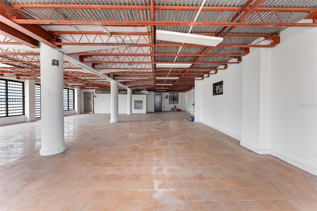 An open-plan commercial space features a tiled floor, white support columns, and an exposed ceiling — 241 ELEANOR ROOSEVELT AVENUE, SAN JUAN, PR