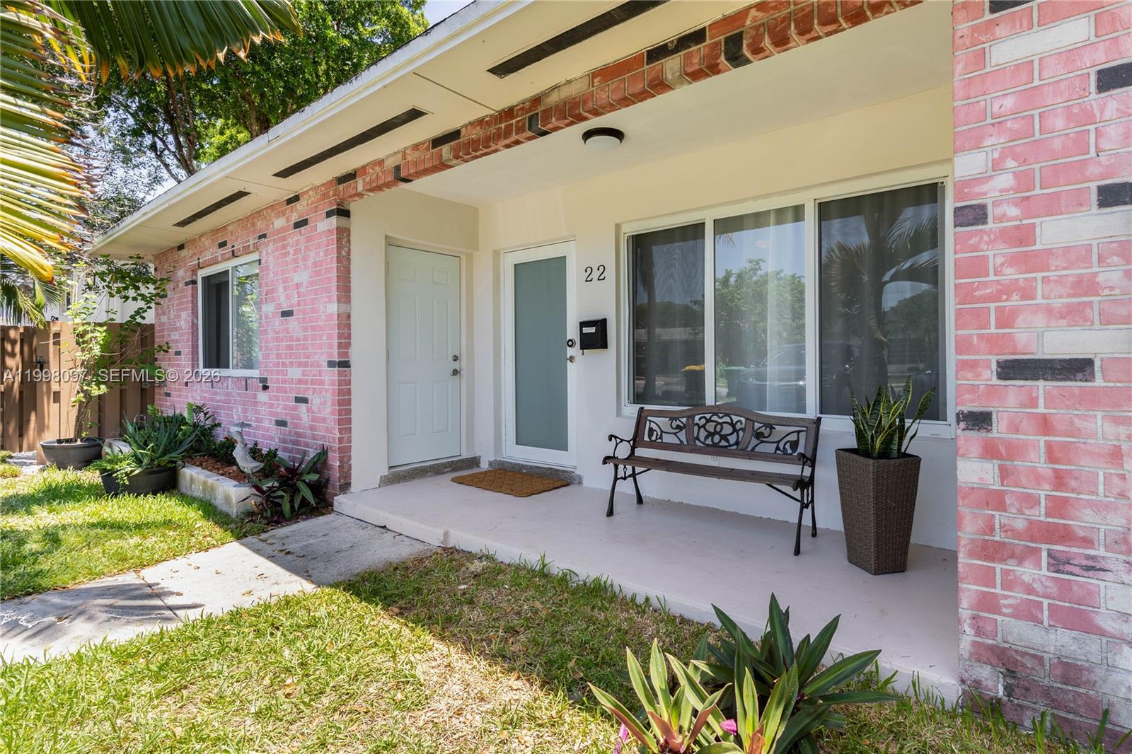 A kitchen features white cabinets, stainless steel appliances, and a light-colored countertop — 20 SE 13th Ter # 2, Dania Beach FL 33004, DANIA BEACH, FL