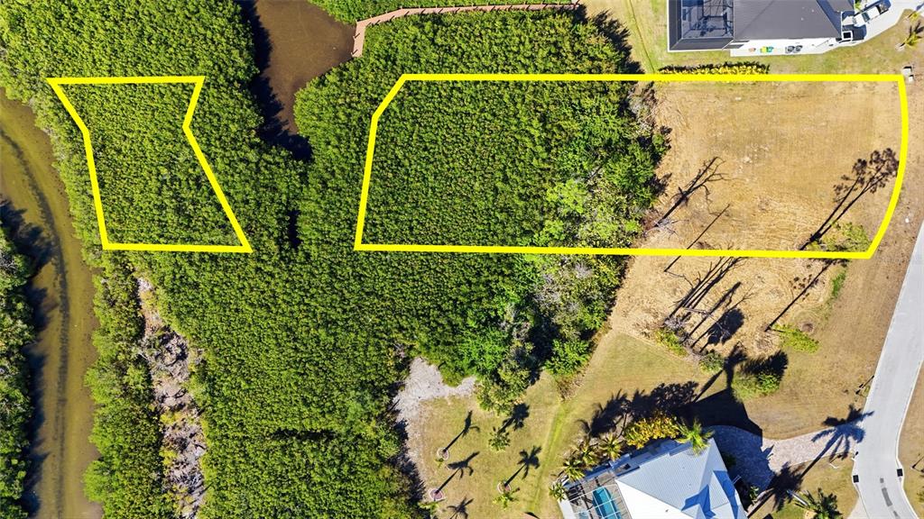 An aerial view shows two yellow-outlined parcels of land, one wooded and one partially cleared — 8041 WEYERS COURT, ENGLEWOOD, FL