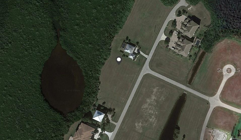This aerial map view shows a residential property with a house, lawn, and adjacent pond — 17459 BOCA VISTA ROAD, PUNTA GORDA, FL