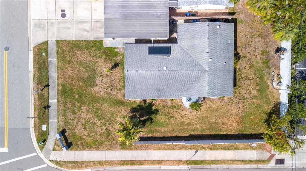 An aerial view shows a house with a gray roof and a large corner lot — 2463 TERRY LANE, SARASOTA, FL