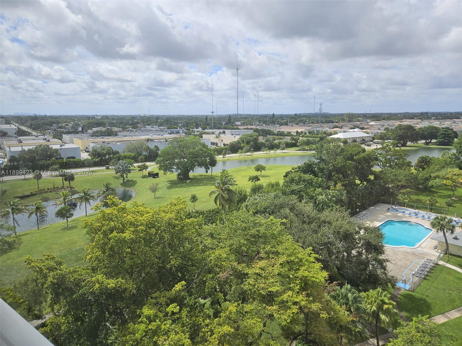 An elevated view shows a green park with a pond and a swimming pool — 4200 Hillcrest Dr # 1015, Hollywood FL 33021, HOLLYWOOD, FL
