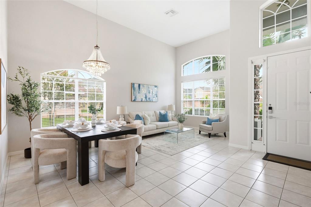 A screened-in patio features a swimming pool, a spa, and paver flooring — 2555 SAND ARBOR CIRCLE, ORLANDO, FL
