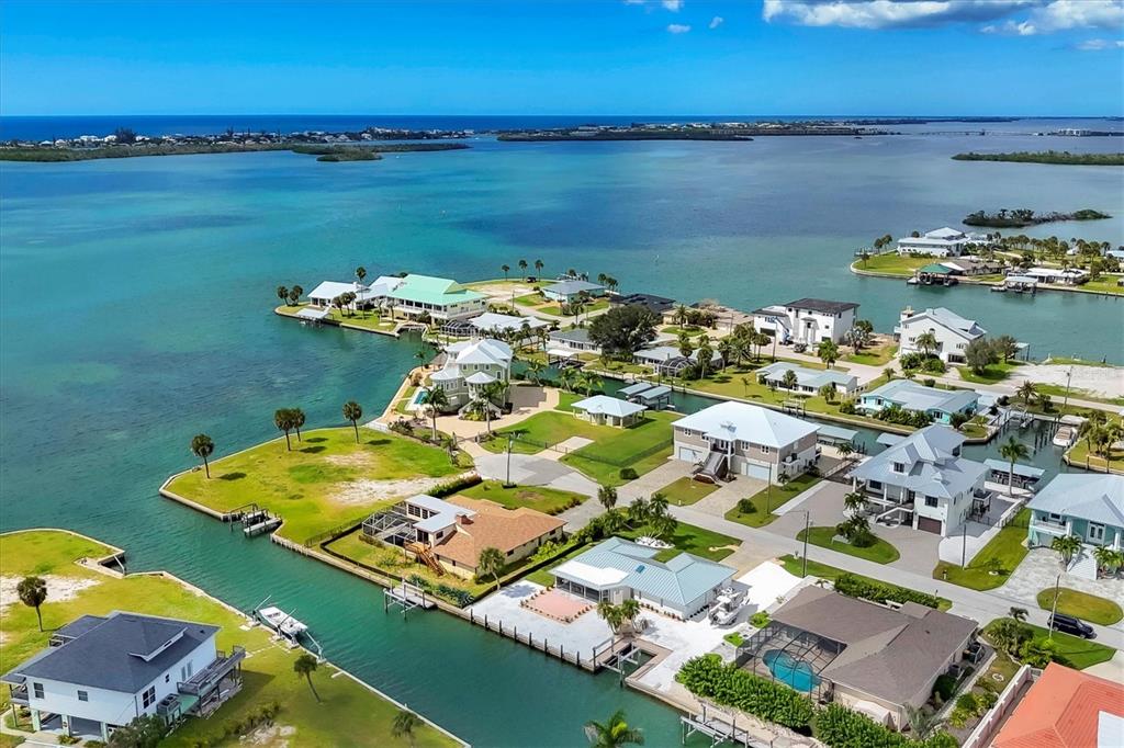 An aerial view shows waterfront homes with private docks along a canal in Florida — 1915 PENNSYLVANIA AVENUE, ENGLEWOOD, FL