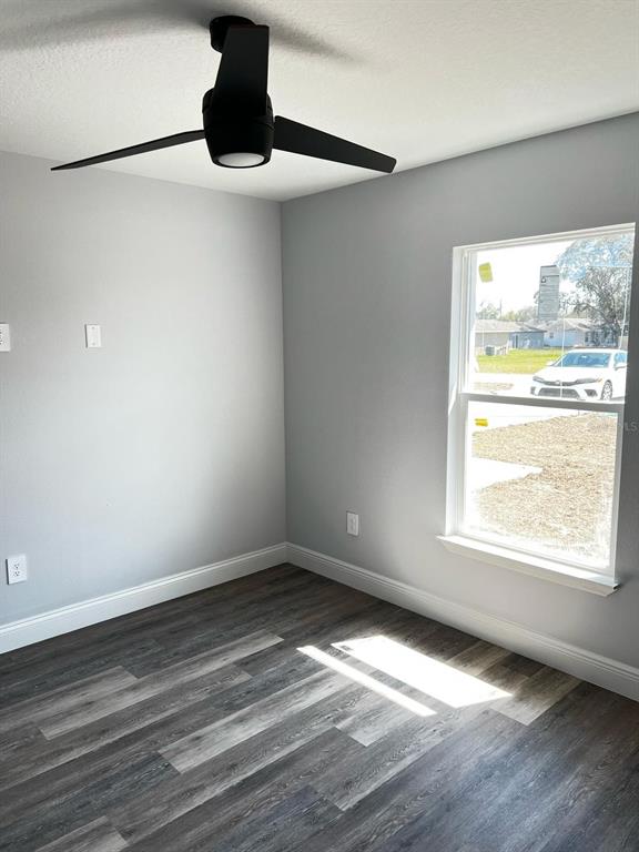 A white single-story house with a two-car garage and a concrete driveway — 843 W GAGE LANE, DUNNELLON, FL