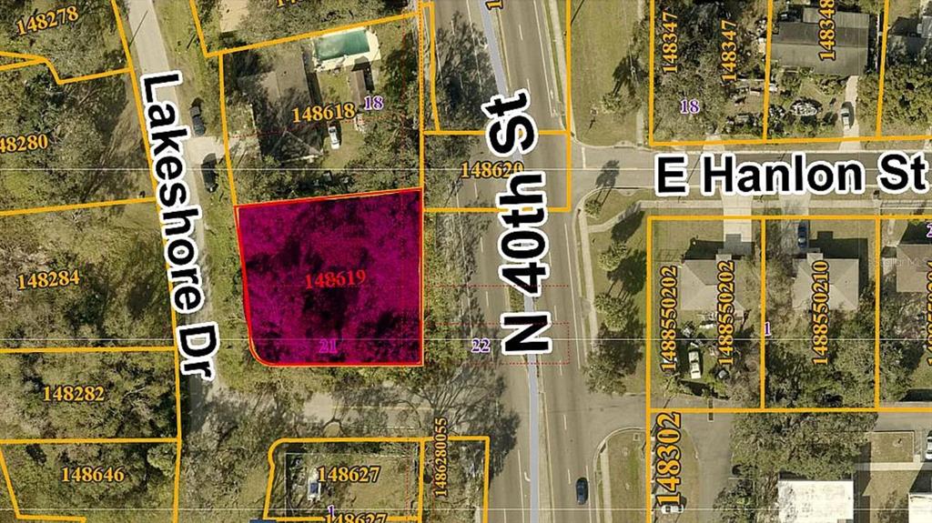 This is an aerial map showing a highlighted vacant lot located at a street intersection — 3902 E HANLON STREET, TAMPA, FL