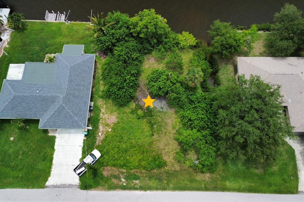 An aerial view shows a vacant, tree-covered residential lot marked with a yellow star — 5226 BOYLE TERRACE, PORT CHARLOTTE, FL