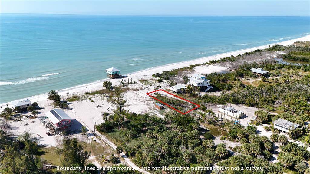 An aerial view shows a coastal lot outlined in red near a beach with houses — 8092 LITTLE GASPARILLA ISLAND, PLACIDA, FL
