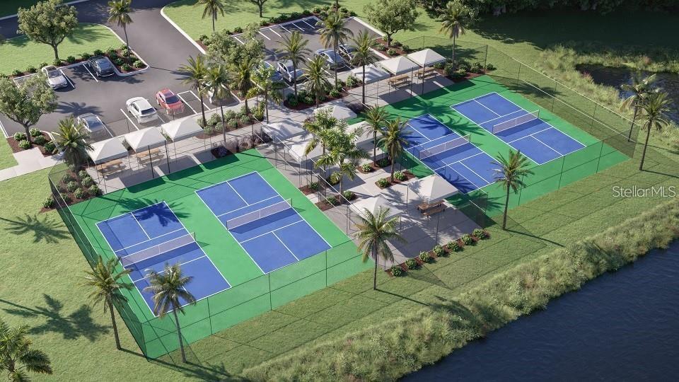 This is a rendering of a pickleball court complex with parking and a nearby pond — 12215 RADIANT GEM TRAIL, PARRISH, FL