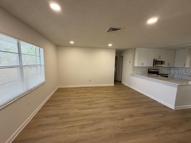 A bathroom featuring a white vanity, a toilet, and a shower with sliding glass doors — 3736 PINE CIRCLE, LAKE WALES, FL