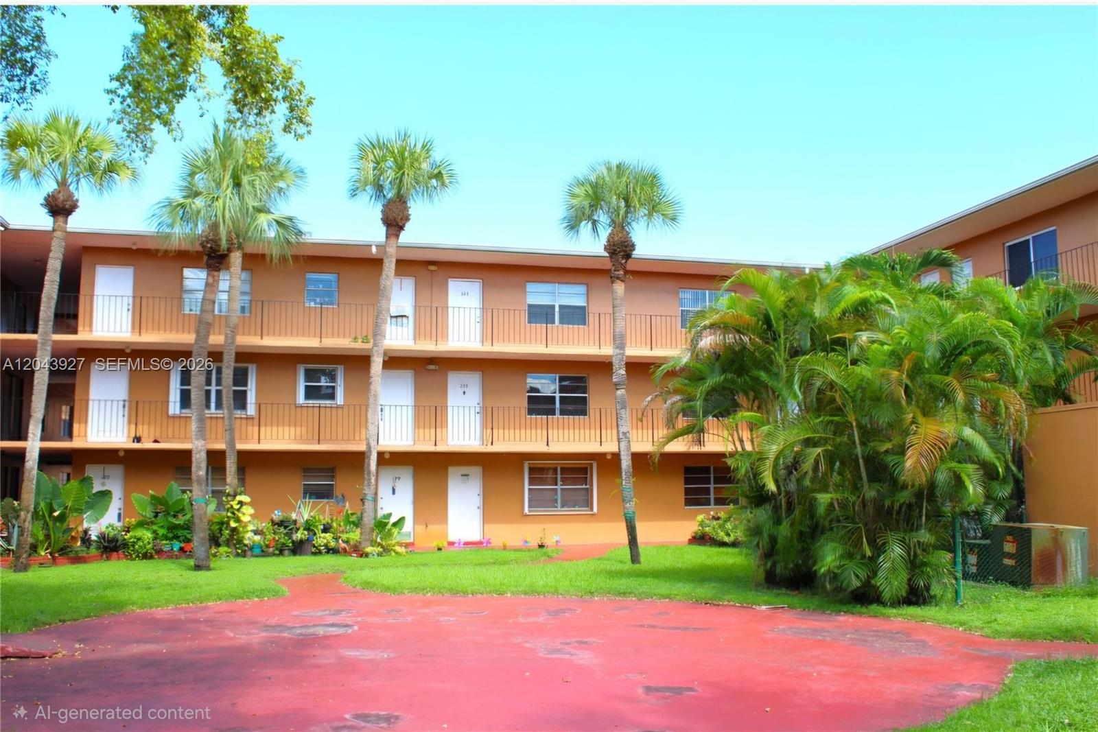 A three-story apartment building with exterior walkways and palm trees in the front yard — 1230 W 54th St # 218A, Hialeah FL 33012, HIALEAH, FL