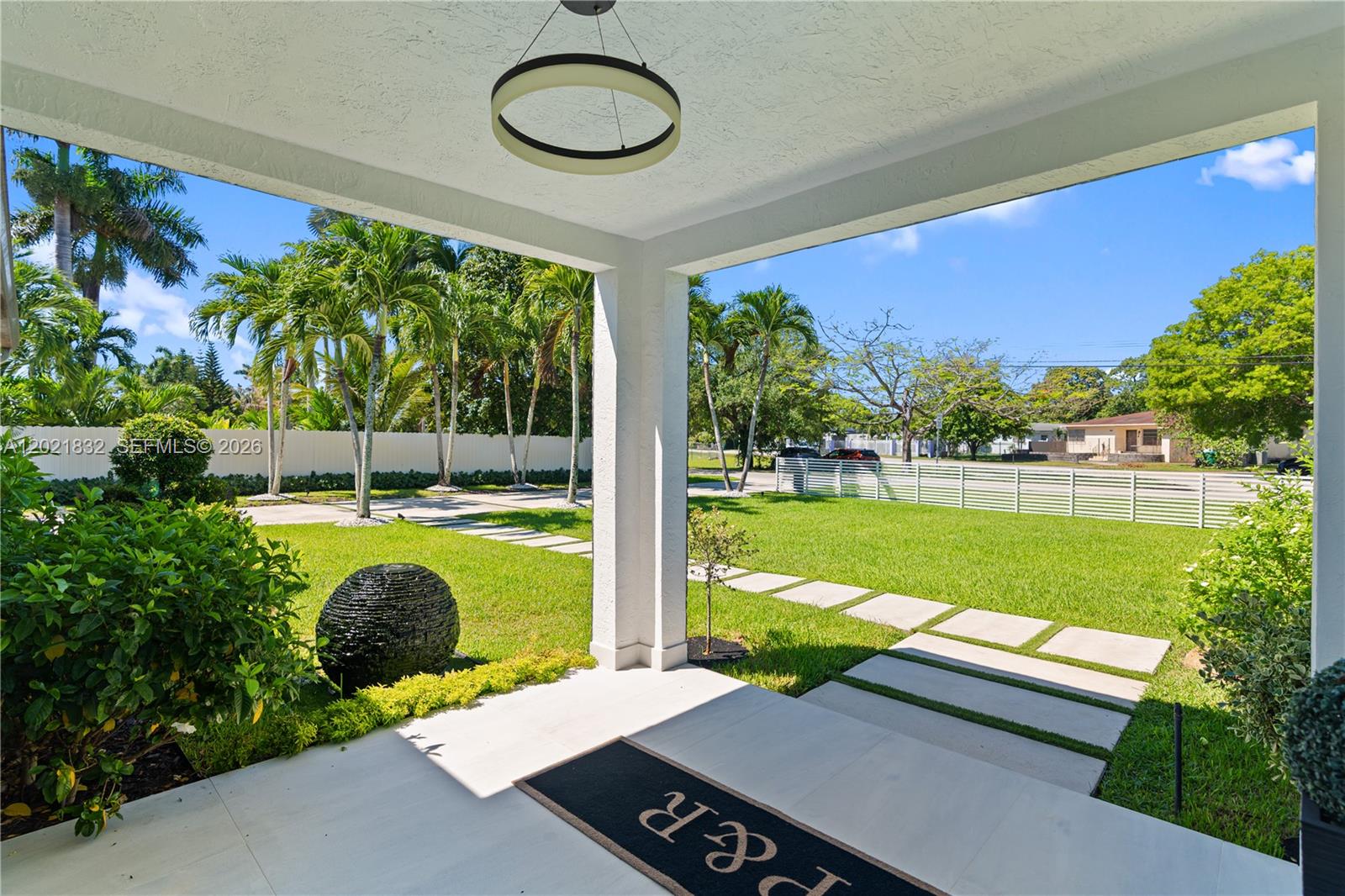 An aerial view shows a house with a pool next to a canal — 14441 S Biscayne River Rd, Miami FL 33161, MIAMI, FL