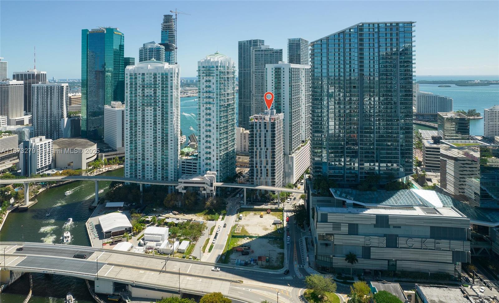 An aerial view of a dense urban skyline featuring high-rise buildings and a waterfront area — 31 SE 6th St # 304, Miami FL 33131, MIAMI, FL