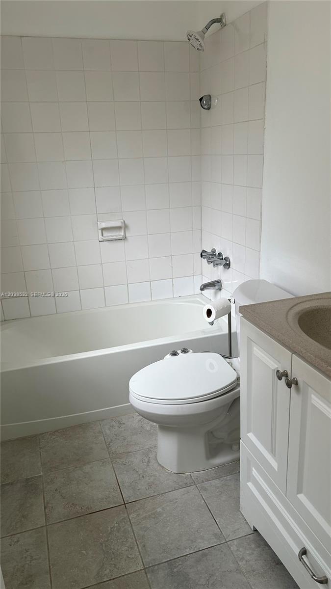 A bathroom features a white bathtub, a toilet with a bidet attachment, and a vanity — 9962 N KENDALL DR # 7, Miami FL 33176, MIAMI, FL