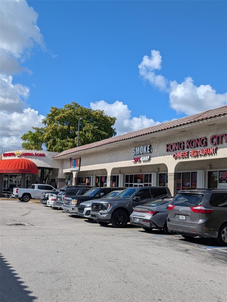 A strip mall features several storefronts, including a Chinese restaurant, under a shared roof — 7373 NW 36th St, Miami FL 33166, MIAMI, FL