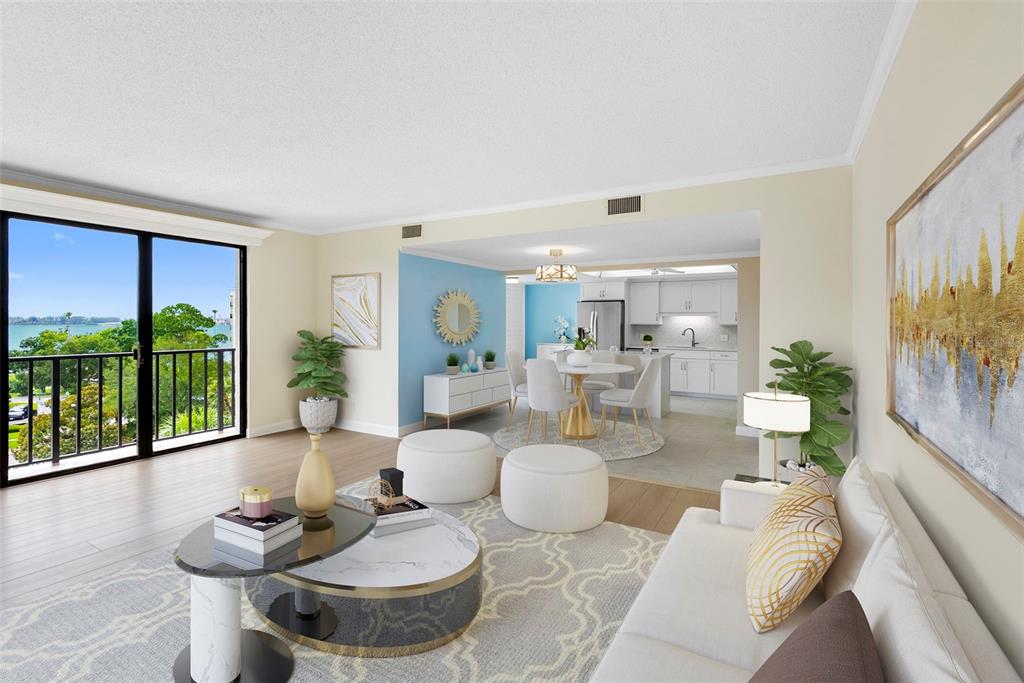 This living and dining area features white furniture, a blue accent wall, and balcony views — 150 BELLEVIEW BOULEVARD UNIT 401, BELLEAIR, FL