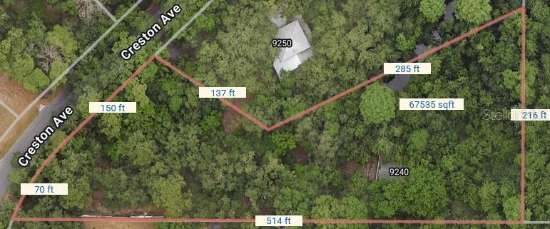 An aerial map shows a wooded lot with property lines and dimensions overlaid on the terrain — 9240 CRESTON AVENUE, NEW PORT RICHEY, FL