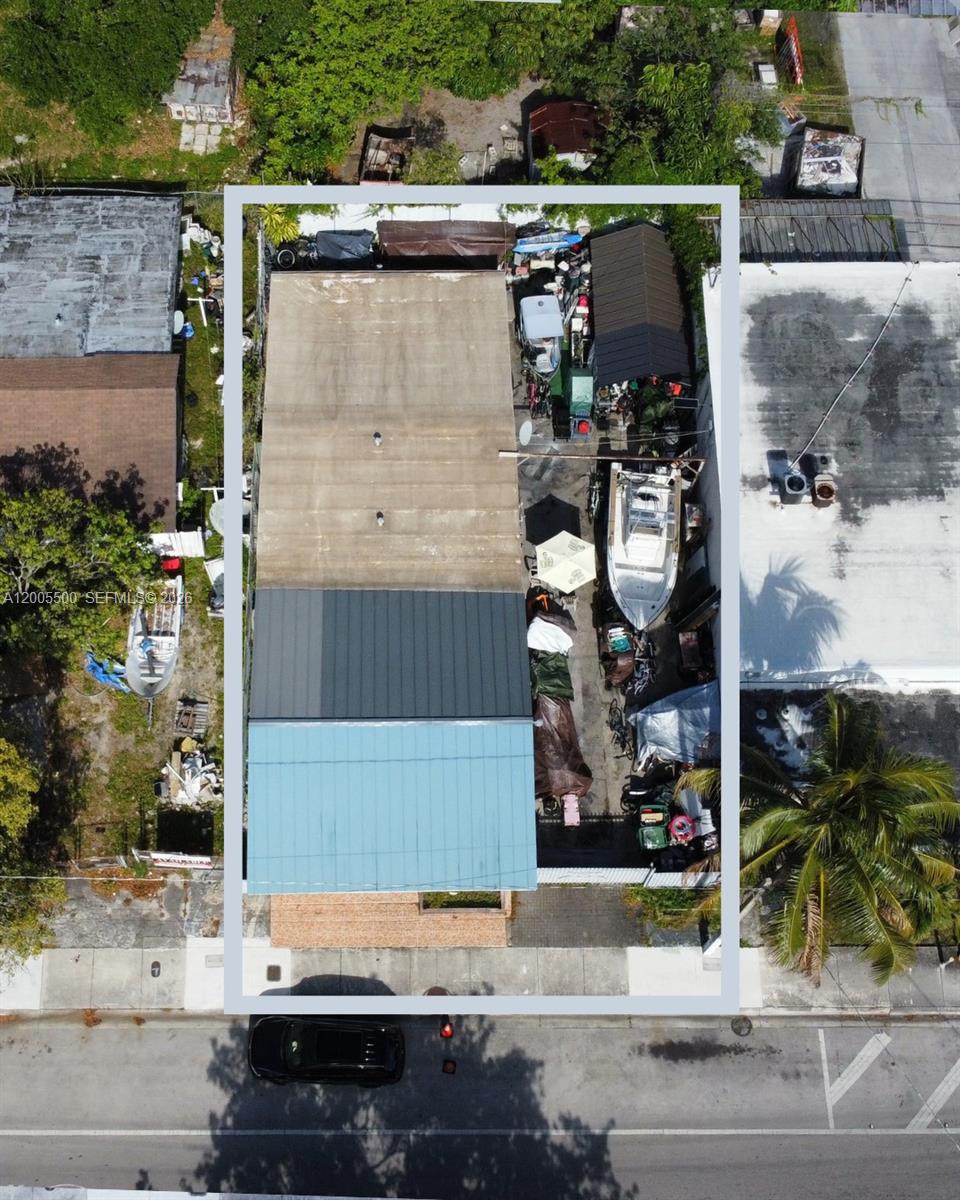 An aerial view shows a rectangular property with a multi-section roof and outdoor storage — 5501 NW 2nd Ave, Miami FL 33127, MIAMI, FL