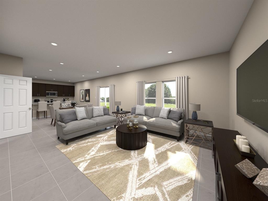 This is a digital rendering of an open-concept living room with grey sofas and tile flooring — 105 OUTBACK HIDEAWAY AVENUE, NOKOMIS, FL