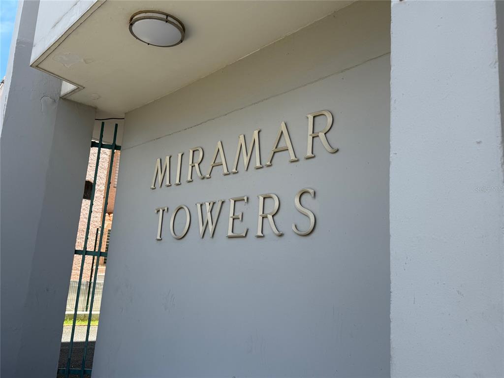 The exterior wall of a building features the metallic lettering Miramar Towers — MIRAMAR TOWERS 721 HERNANDEZ ST. UNIT 12 D, SAN JUAN, PR