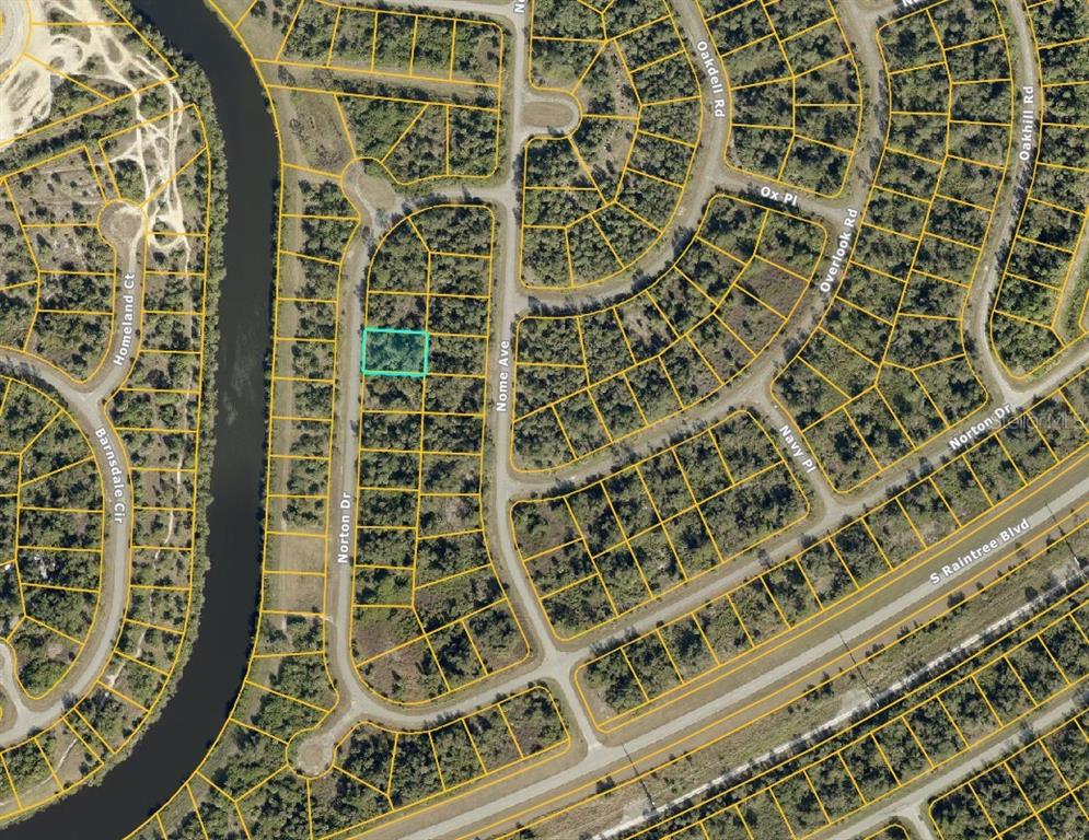 This is an aerial map view of a vacant residential lot highlighted in blue — LOT 9 NORTON DRIVE, NORTH PORT, FL
