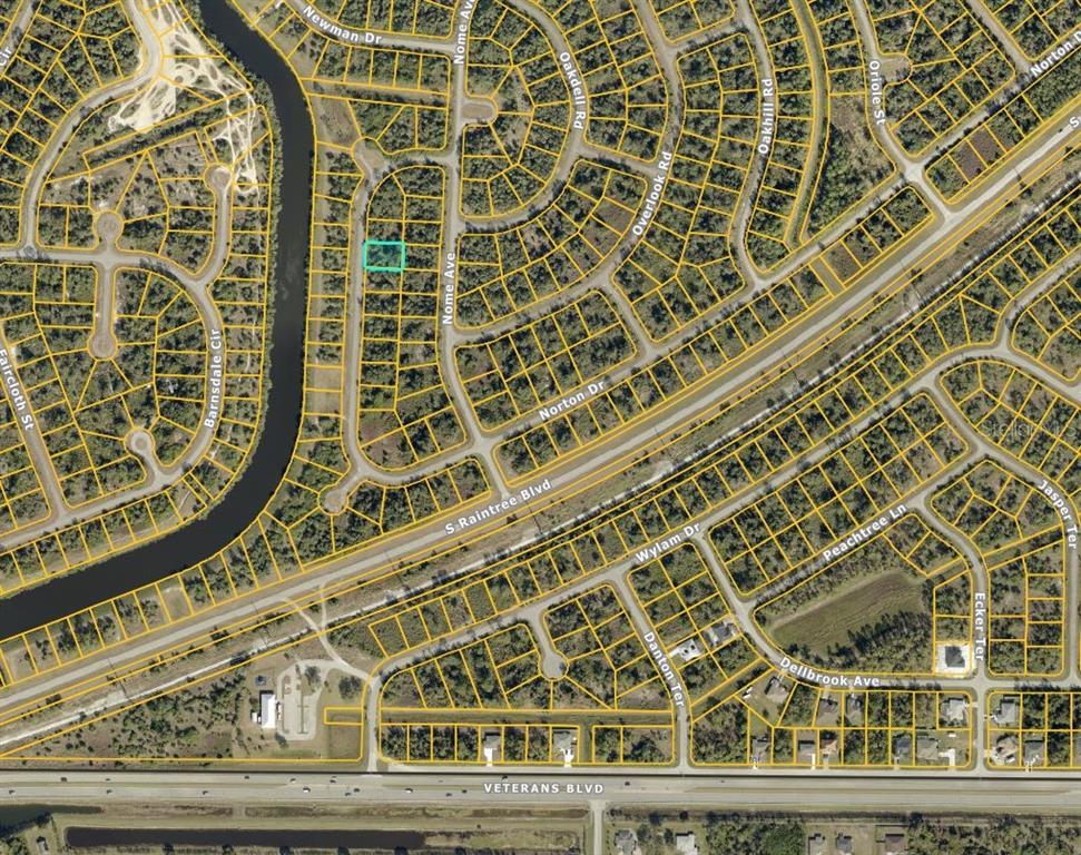 This is an aerial map showing a highlighted vacant lot within a residential neighborhood — LOT 9 NORTON DRIVE, NORTH PORT, FL