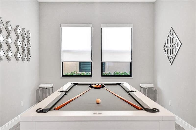A game room features a white pool table with a grey felt top and wall-mounted mirrors — 11720 Waterway Circle, Parkland FL 33076, PARKLAND, FL