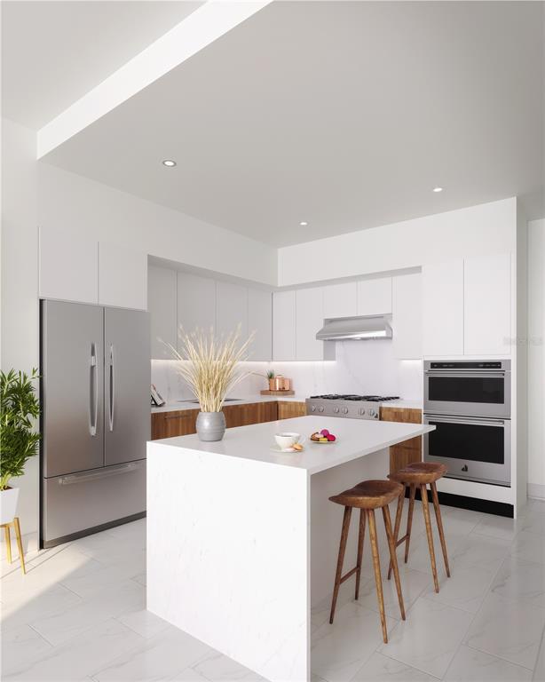 This rendering shows a modern kitchen with white cabinetry, a marble-topped island, and stainless appliances — 400 CENTRAL AVENUE UNIT 3209, ST PETERSBURG, FL