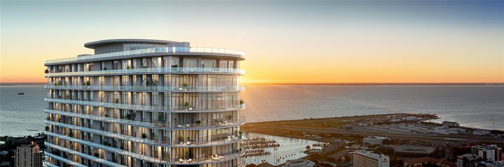 This is a rendering of a modern high-rise apartment building overlooking a bay at sunset — 400 CENTRAL AVENUE UNIT 3209, ST PETERSBURG, FL