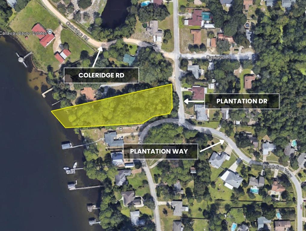 This aerial map shows a highlighted waterfront lot located near the intersection of several roads — TBD PLANTATION DRIVE, PANAMA CITY, FL