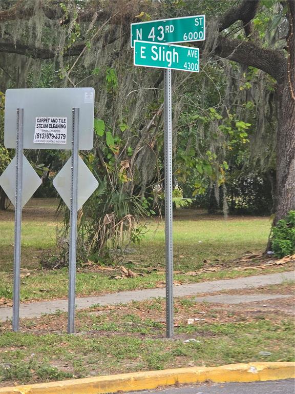 A street sign at the intersection of North 43rd Street and East Sligh Avenue — 7146 E BANK DRIVE UNIT 7146, TAMPA, FL