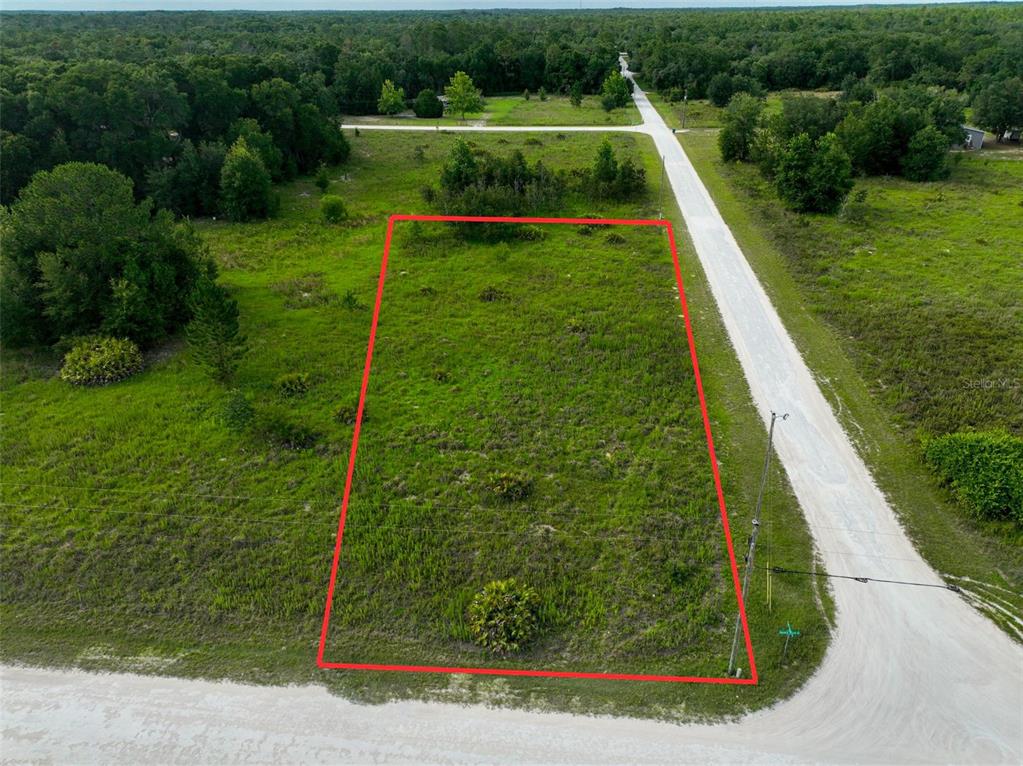 An aerial view shows a rectangular vacant lot outlined in red along a dirt road — 9017 SPLIT STONE DRIVE, WEBSTER, FL
