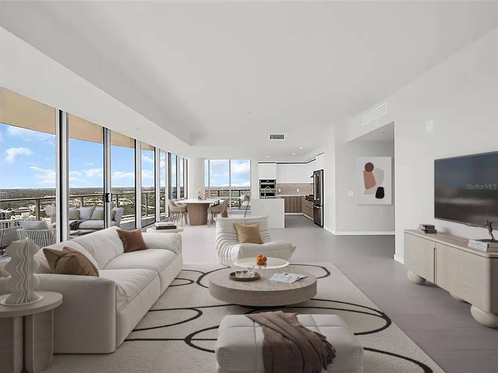 A modern open-concept living room and kitchen with floor-to-ceiling windows and a balcony — 400 CENTRAL AVENUE UNIT 3401, ST PETERSBURG, FL