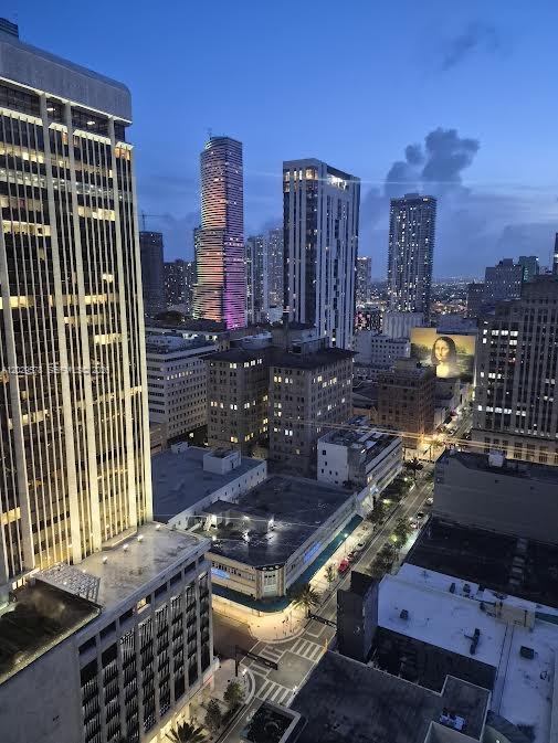 An elevated view of a city skyline at dusk featuring several tall skyscrapers — 50 Biscayne Blvd # 2707, Miami FL 33132, MIAMI, FL