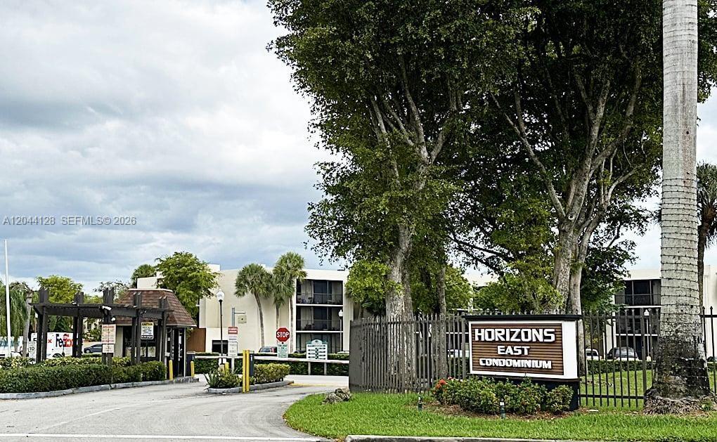 The entrance to the Horizons East Condominium features a gated driveway and a prominent sign — 8025 SW 107th Ave # 313, Miami FL 33173, MIAMI, FL