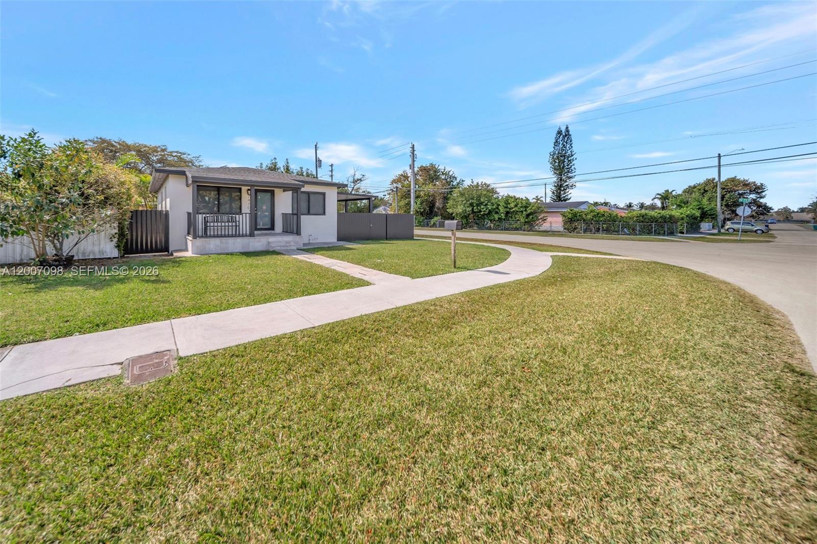 A single-story house with a small front porch sits on a corner lot — 7470 SW 37th St, Miami FL 33155, MIAMI, FL