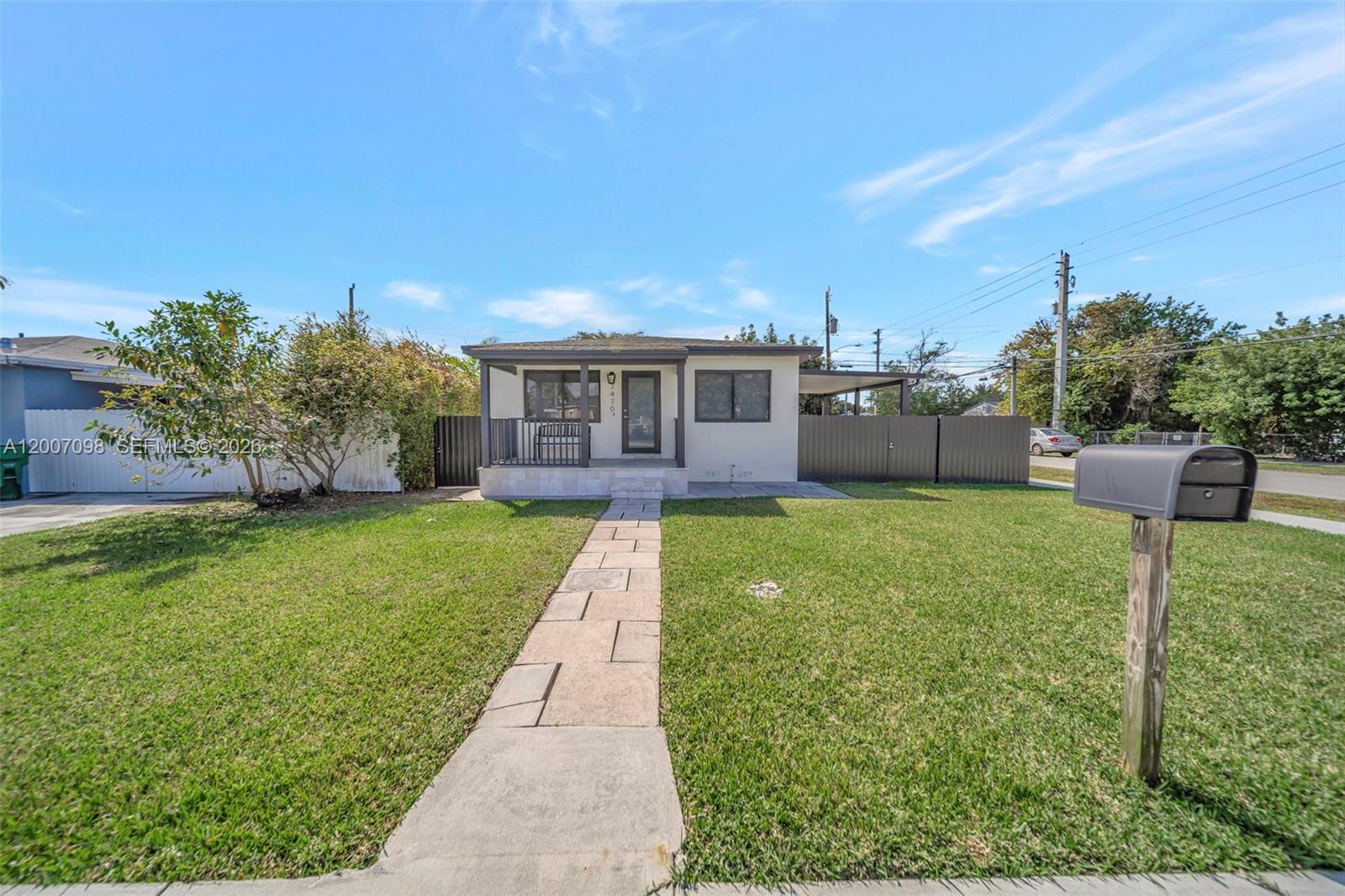 A single-story house with a front porch, a stone walkway, and a gray mailbox — 7470 SW 37th St, Miami FL 33155, MIAMI, FL
