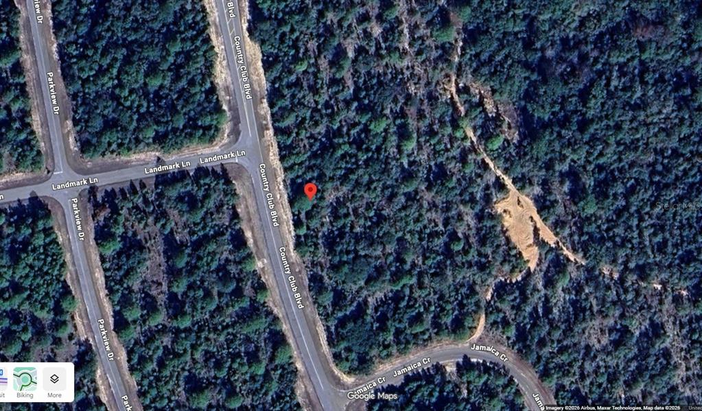 This is a satellite map view showing a vacant, wooded lot near a road intersection — Lot 29 Unit 2 Blk 218 COUNTRY CLUB BOULEVARD, CHIPLEY, FL