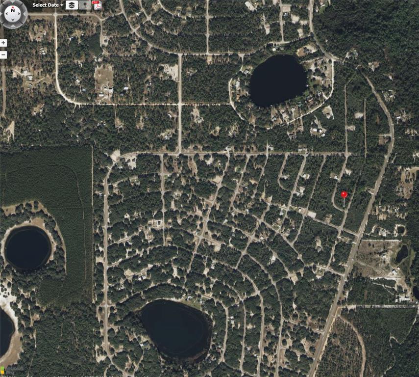 This is an aerial map view showing a residential neighborhood with several lakes and trees — FISHER WAY TRACK, OCKLAWAHA, FL