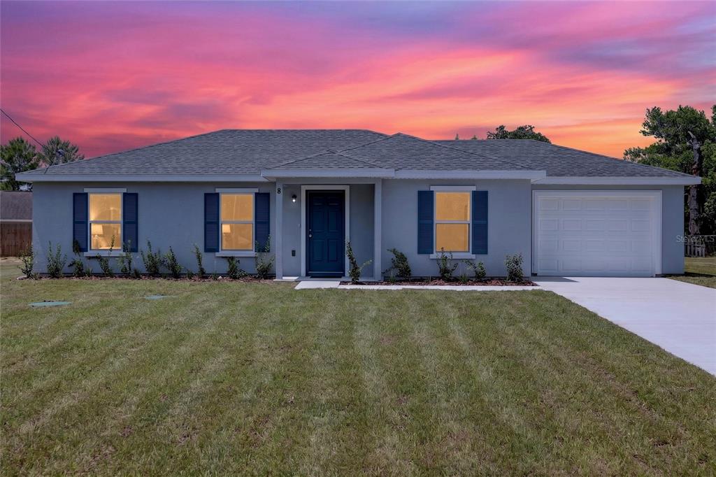 A single-story house with a gray exterior, dark blue shutters, and a one-car garage — 8 OAK CIRCLE TRACE, OCALA, FL