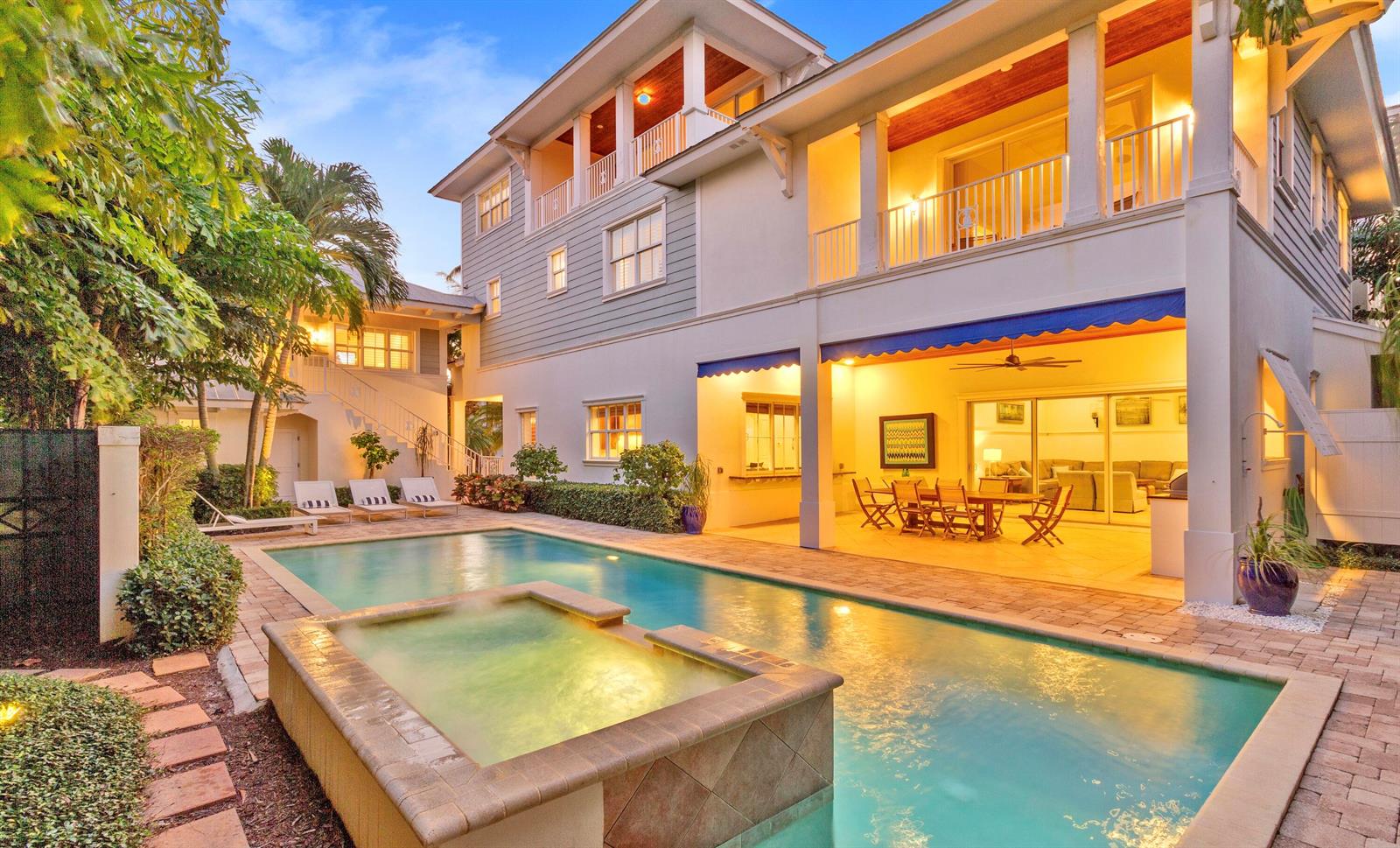 A multi-story house with a swimming pool, hot tub, and covered patio area — 111 Beachwalk Lane, Jupiter FL 33477, JUPITER, FL