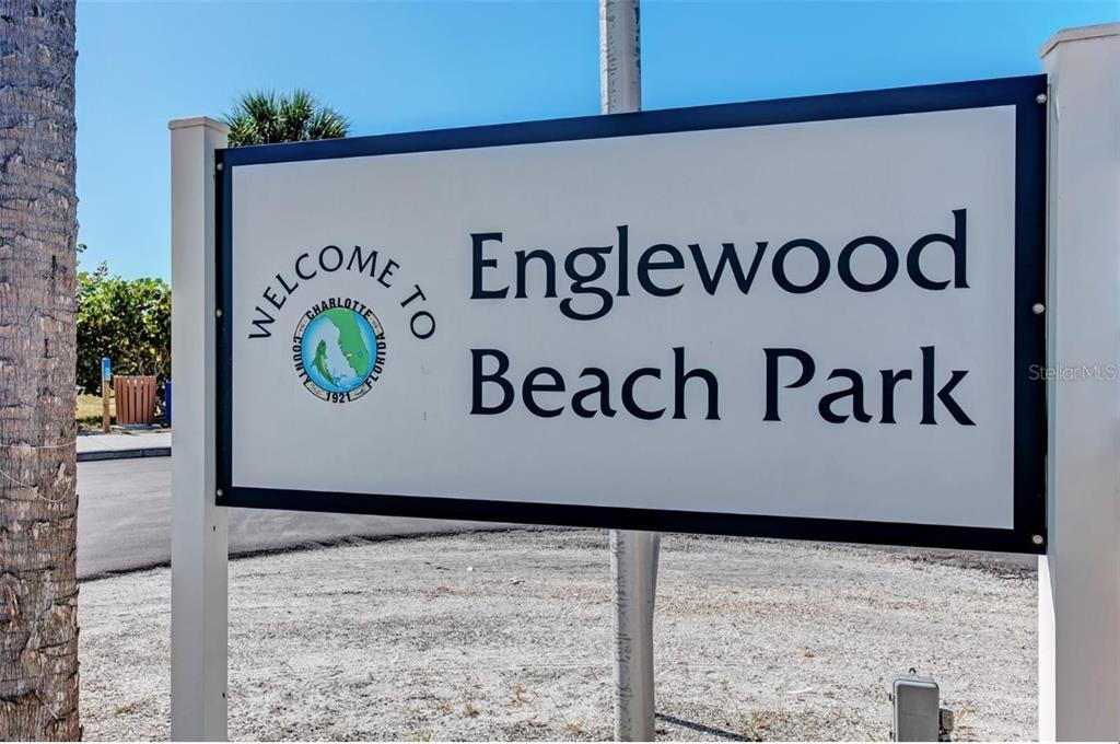 A white sign welcomes visitors to Englewood Beach Park in Charlotte County, Florida — 250 SALUDA TERRACE, PORT CHARLOTTE, FL