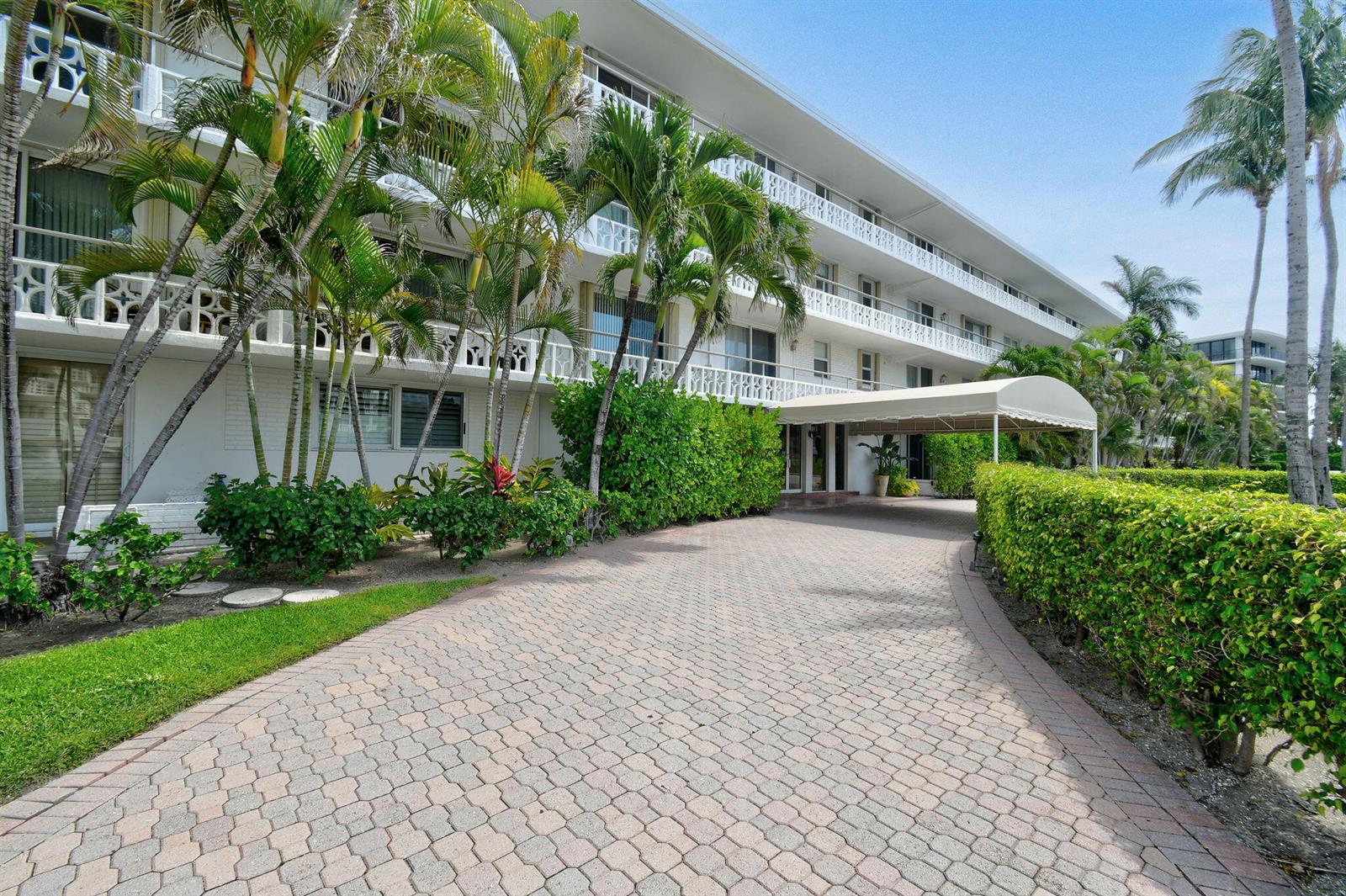 A multi-story white apartment building with a paved driveway and a covered entrance canopy — 139 Sunrise Avenue # 2030, Palm Beach FL 33480, PALM BEACH, FL