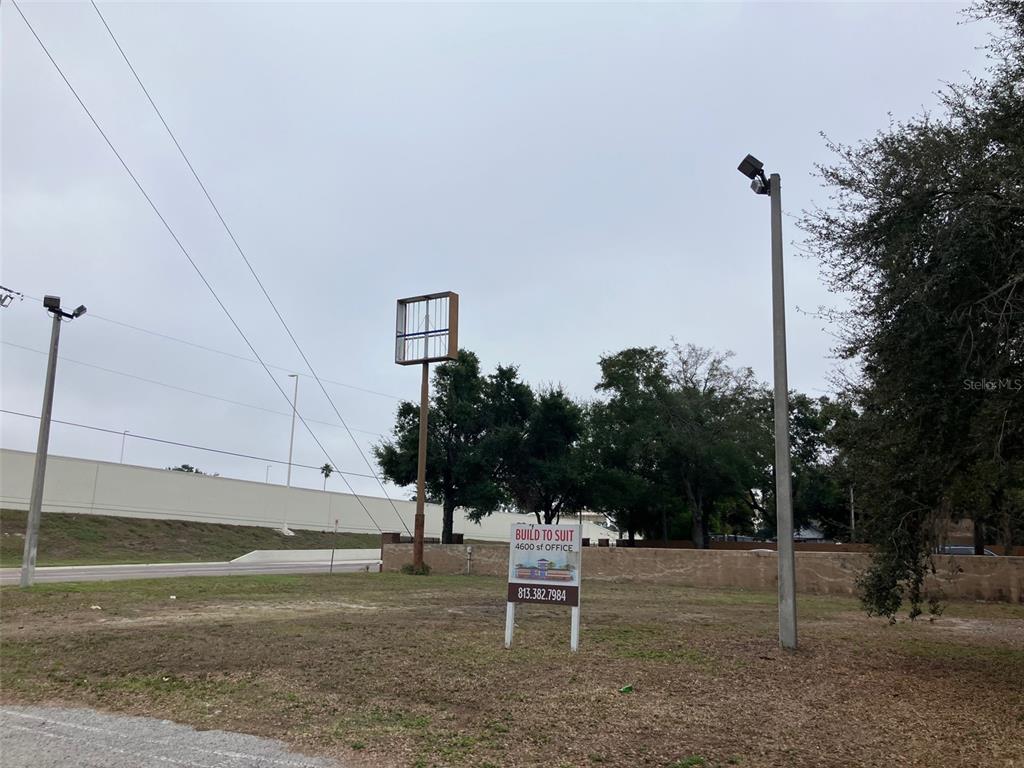 A vacant lot features a sign advertising a 4,600-square-foot office build-to-suit opportunity — 3900 N MARGUERITE AVENUE, TAMPA, FL